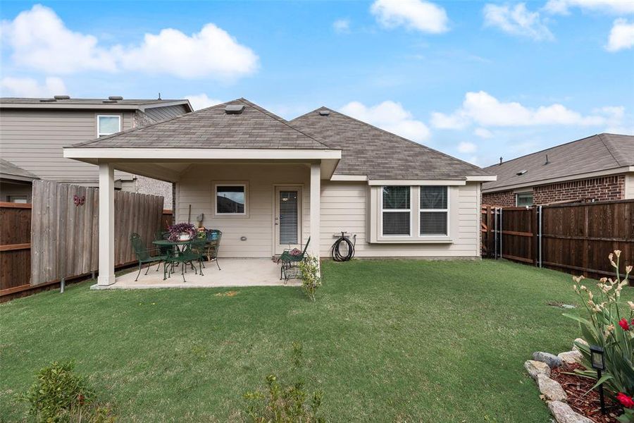 Exterior details and patio area of a home in Walden Pond, Forney (Image 23).
