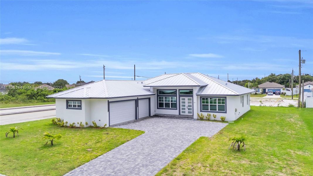 Front exterior of a new home in , Port St. Lucie, FL, highlighting curb appeal (Image 28).