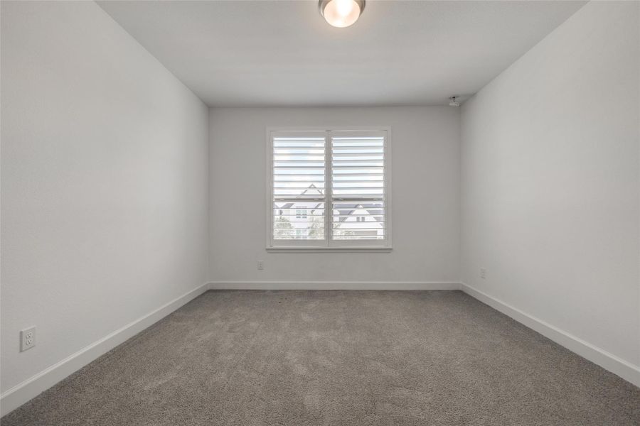 Bedroom 3 with carpet, blinds