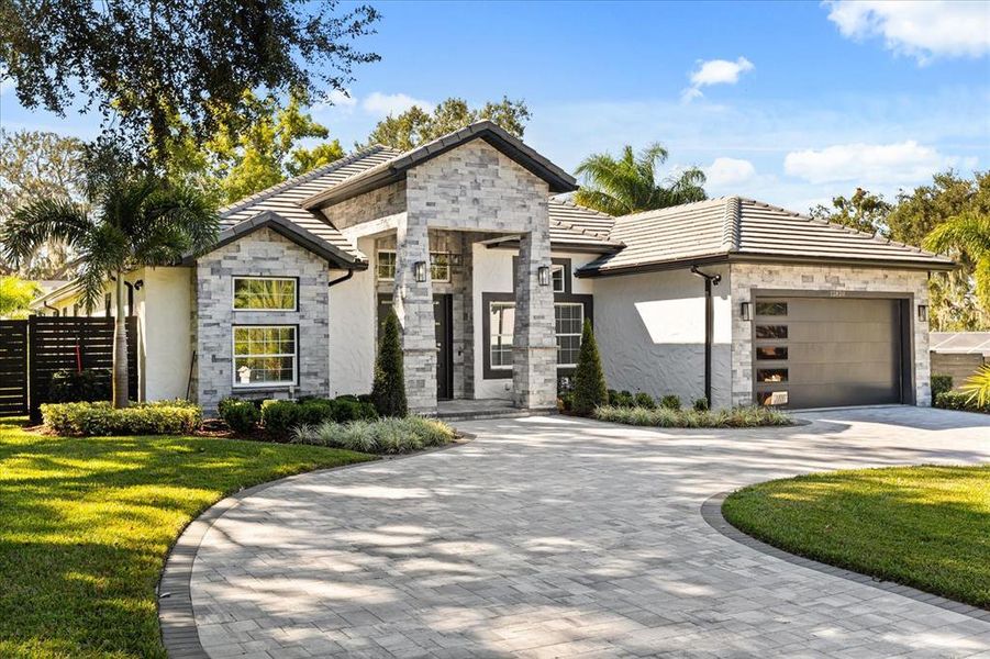 Front exterior of a new home in , Clermont, FL, highlighting curb appeal (Image 2). Front exterior of a new home in , Clermont, FL, highlighting curb appeal (Image 2).