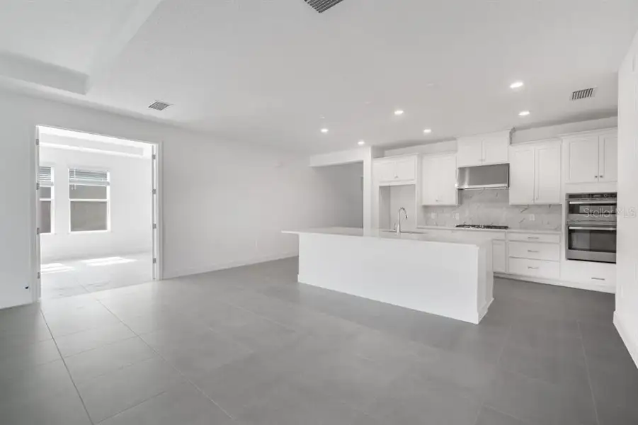 Spacious, unfurnished interior of a new home in Harvest at Ovation, Winter Garden (Image 18). Spacious, unfurnished interior of a new home in Harvest at Ovation, Winter Garden (Image 18).