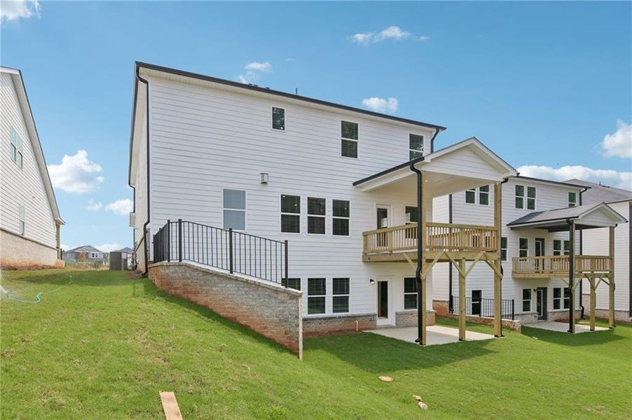 Exterior details and patio area of a home in Martin Springs - Estate Series, Lawrenceville (Image 32).