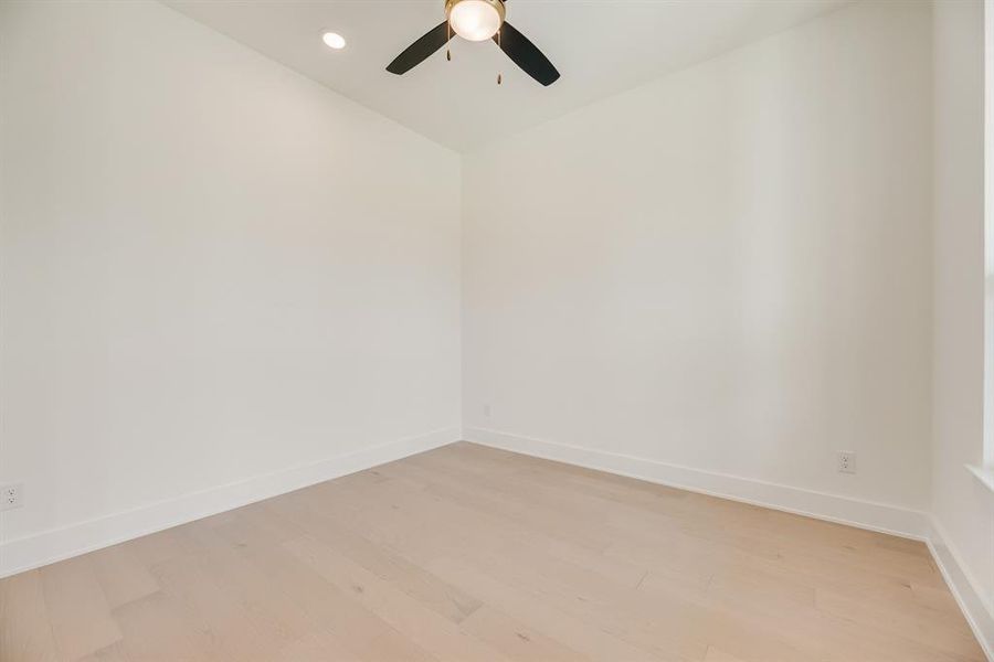 Unfurnished room with wood finished floors, recessed lighting, and a ceiling fan Unfurnished room with wood finished floors, recessed lighting, and a ceiling fan