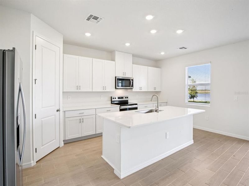 Furnished interior view inside a new home in Coasterra - Reserve Series, Palmetto (Image 6).