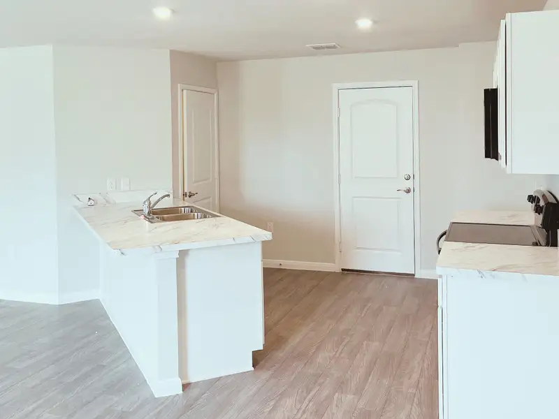 Representative furnished interior of a home built from the Sequoia by National HomeCorp in Summit Place, Eden (Image 9).