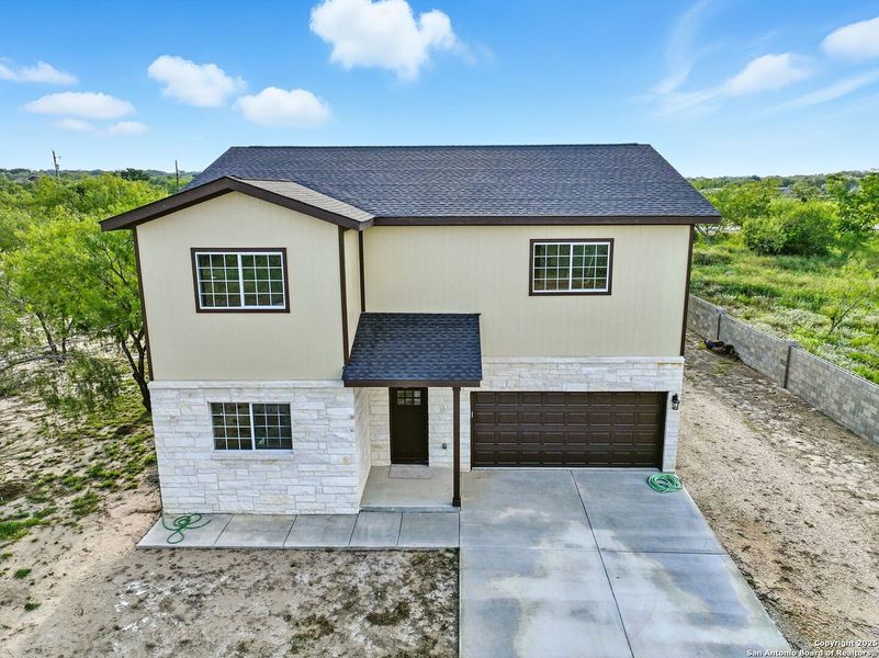 Front exterior of a new home in , Lytle, TX, highlighting curb appeal (Image 20). Front exterior of a new home in , Lytle, TX, highlighting curb appeal (Image 20).