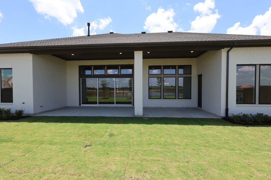 Exterior details and patio area of a home in Dunham Pointe, Cypress (Image 4). Exterior details and patio area of a home in Dunham Pointe, Cypress (Image 4).