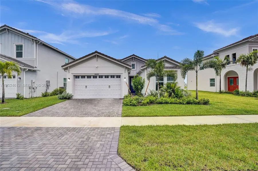 Front exterior of a new home in , Westlake, FL, highlighting curb appeal (Image 30).