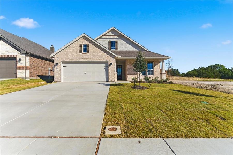 Front exterior of a new home in Waterford Park, Weatherford, TX, highlighting curb appeal (Image 21).