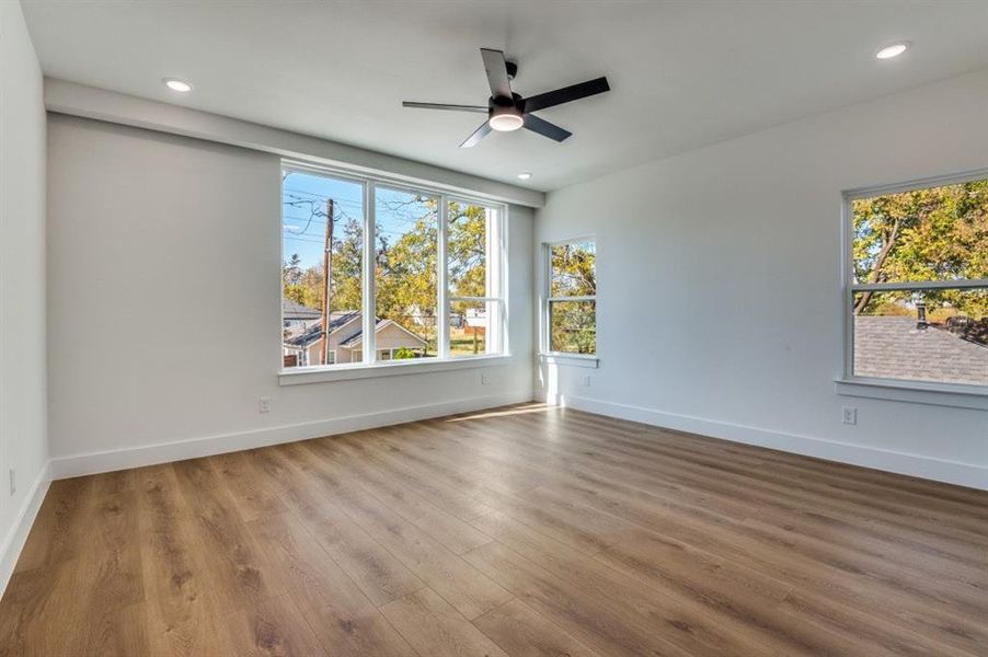 Unfurnished room featuring wood finished floors, recessed lighting, and ceiling fan
