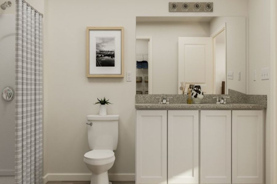 A bathroom with a toilet and sink.