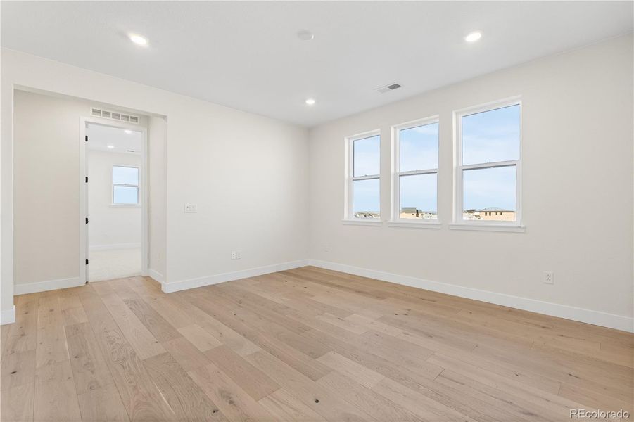 Spacious, unfurnished interior of a new home in Autograph at Lyric, Lone Tree (Image 47).