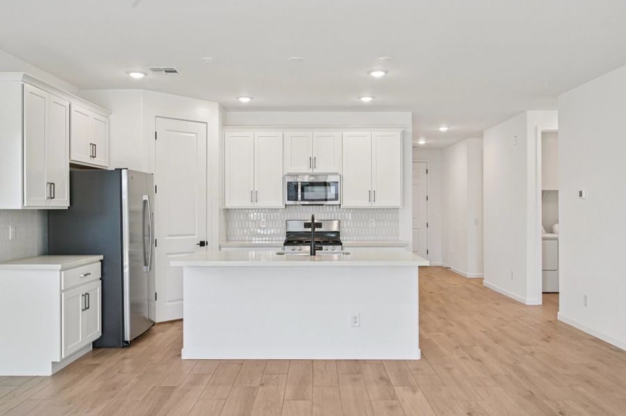 Kitchen featuring the Harmony Collection. Not actual home, finishes may vary. Kitchen featuring the Harmony Collection. Not actual home, finishes may vary.