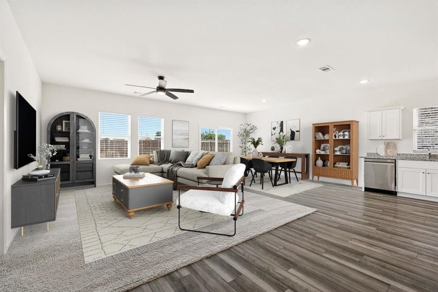 Virtually staged living area with recessed lighting, dark wood-style floors, and ceiling fan Virtually staged living area with recessed lighting, dark wood-style floors, and ceiling fan