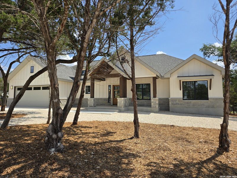 Front exterior of a new home in , Canyon Lake, TX, highlighting curb appeal (Image 29).
