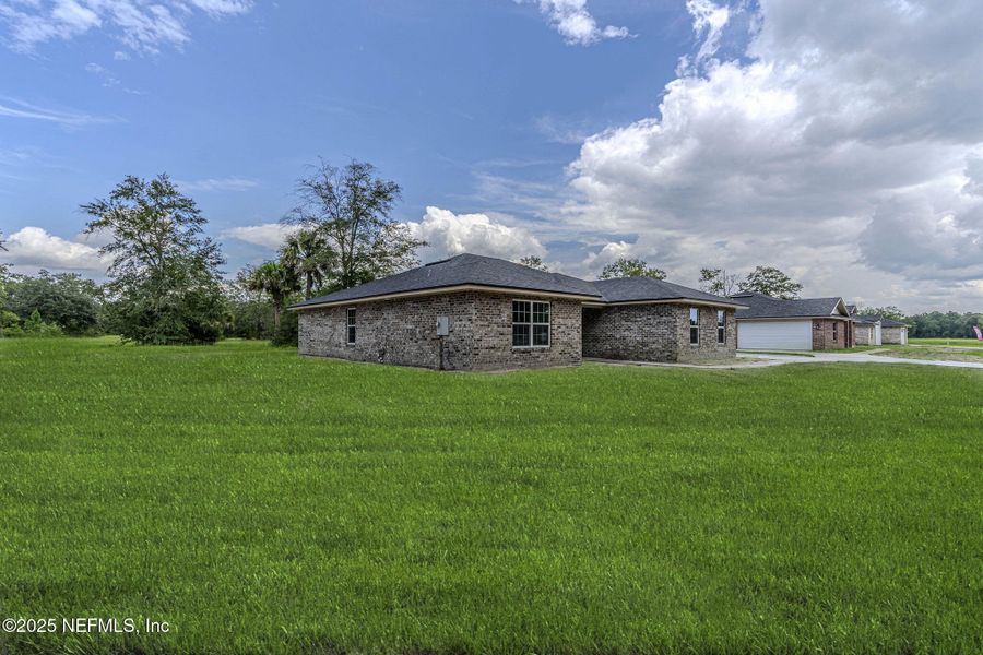 Front exterior of a new home in , Callahan, FL, highlighting curb appeal (Image 13).