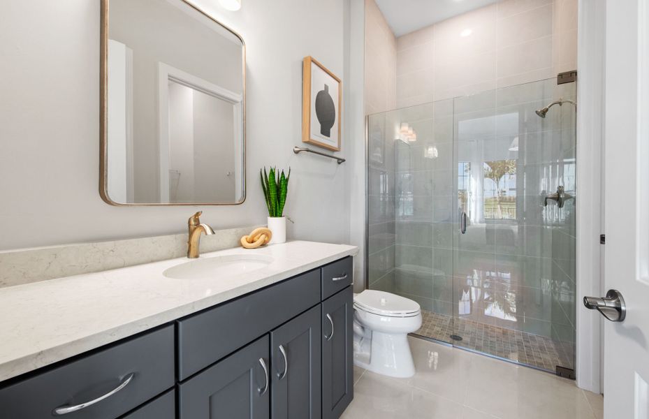 Secondary bathroom with glass shower door enclosure Secondary bathroom with glass shower door enclosure