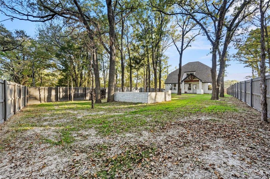 View of fenced backyard