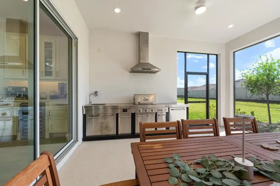 Exterior details and patio area of a home in Esplanade at Artisan Lakes, Palmetto (Image 3).