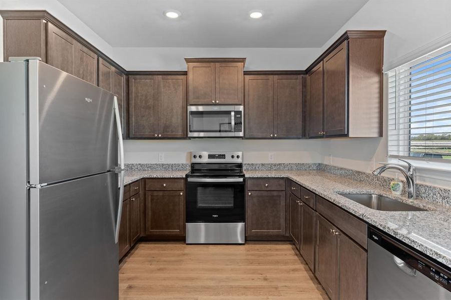 Kitchen with stainless steel appliances.