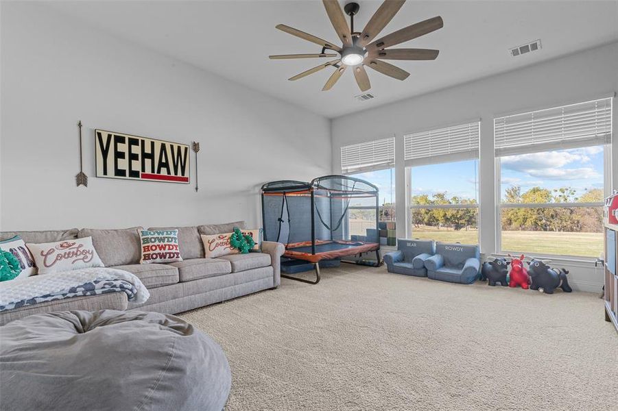 Game room featuring ceiling fan and carpet floors