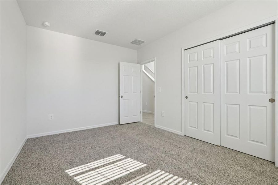 Spacious, unfurnished interior of a new home in Lake Deer Estates - Signature Series, Poinciana (Image 25).