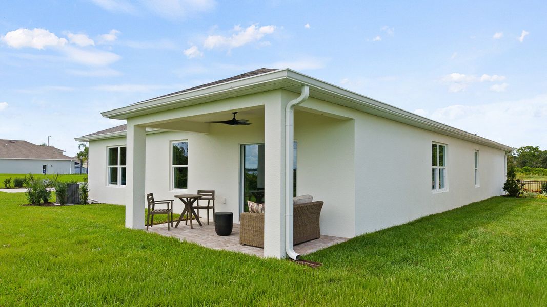 Castaway Model Home rear exterior with covered lanai in new home plan available at Liberty Trace in Haines City, fl