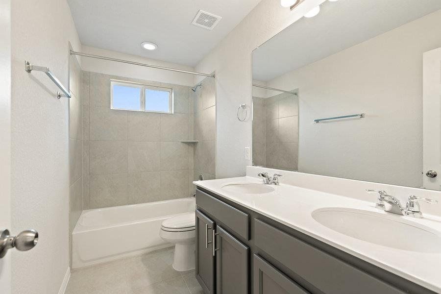 Photos are of a completed model of the same floor plan and are for illustrative purposes only. Actual home is under construction and design selections, materials, and features may differ. Confirm final specifications with the New Home Consultant.