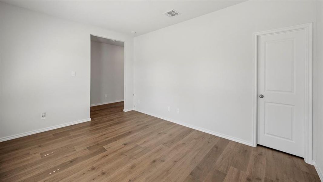 Unfurnished room featuring dark wood-type flooring