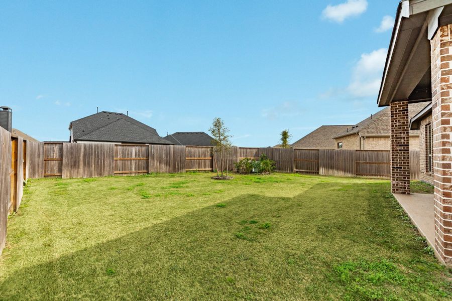 This view showcases the expansive backyard and the privacy of having no rear neighbors. This view showcases the expansive backyard and the privacy of having no rear neighbors.