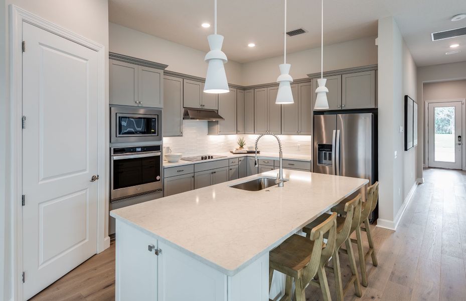 Representative furnished interior of a home built from the Mystique by DiVosta in Emerson Oaks, Vero Beach (Image 10).