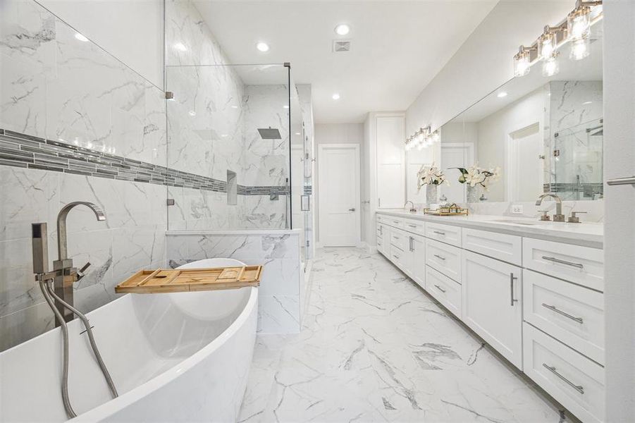 Soaking tub has standing plumbing fixtures.