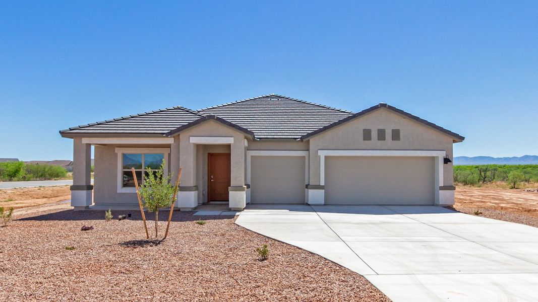 Representative exterior photo of a completed home built from the Sedona - Plan H50T7 by D.R. Horton in Sahuarita Acres, Sahuarita, AZ (Image 1).