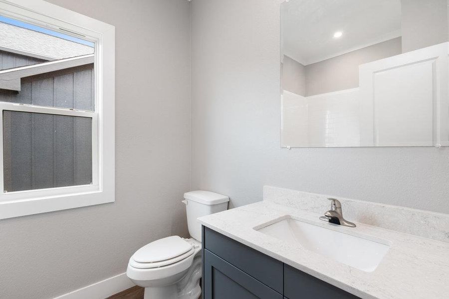 Full bathroom with vanity and a shower