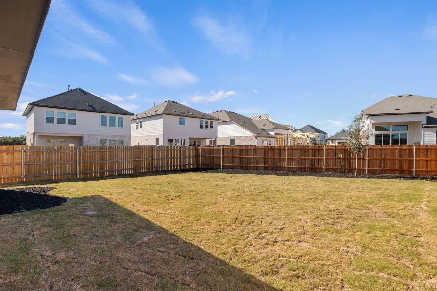 Exterior details and patio area of a home in Heritage, Dripping Springs (Image 22).