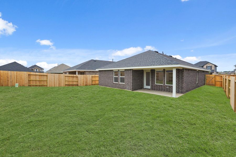 Front exterior of a new home in Cypress Green, Hockley, TX, highlighting curb appeal (Image 1). Front exterior of a new home in Cypress Green, Hockley, TX, highlighting curb appeal (Image 1).