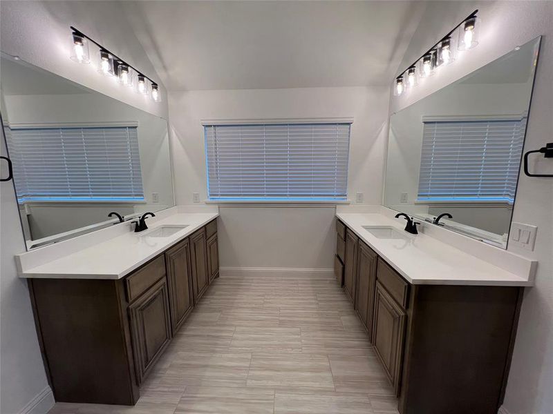 Master bathroom featuring two vanities Master bathroom featuring two vanities