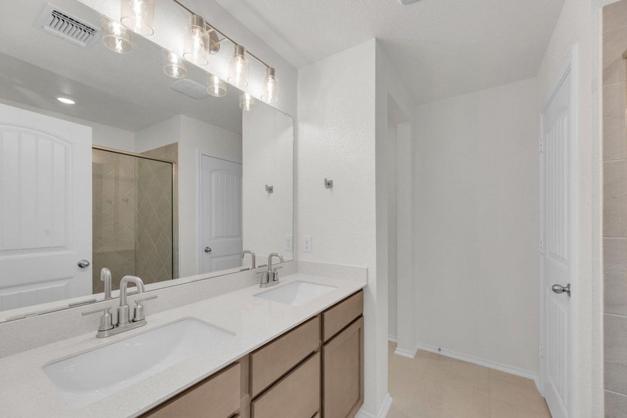 Furnished interior view inside a new home in Mustang Valley, Manor (Image 9).