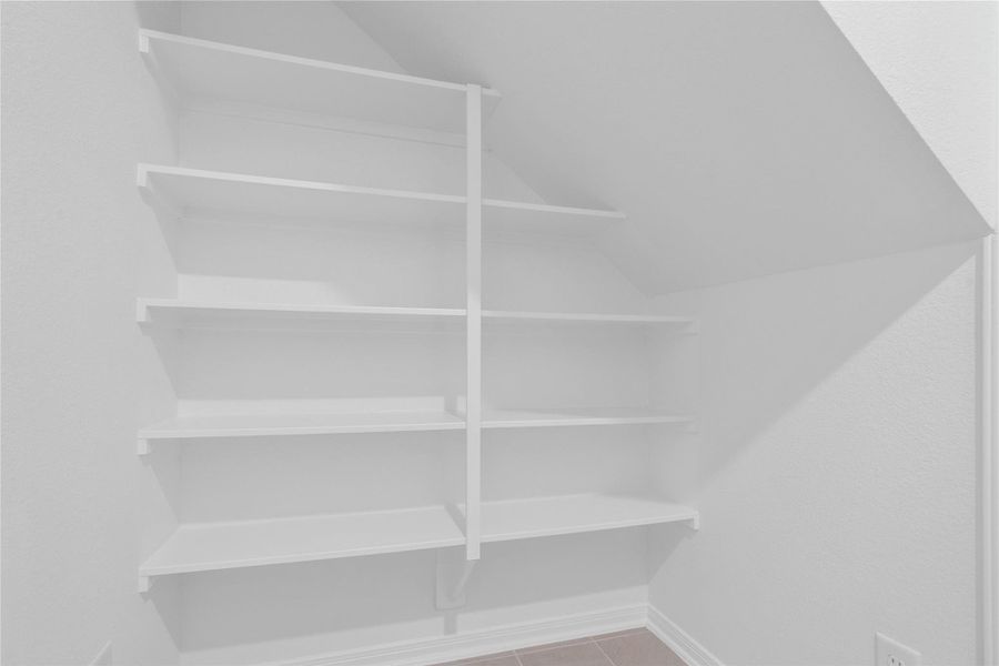 Maximize your storage with a generous, custom-built pantry featuring wrap-around shelving to keep your kitchen perfectly organized. Maximize your storage with a generous, custom-built pantry featuring wrap-around shelving to keep your kitchen perfectly organized.