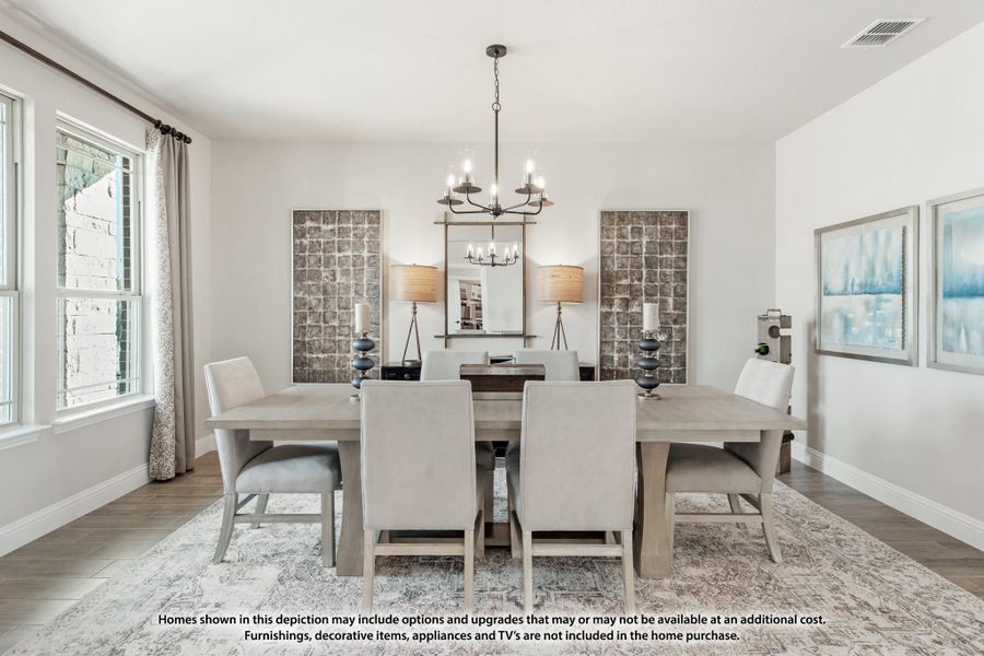 Dining room with gray wood table, six upholstered chairs, chandelier, and hardwood floors Dining room with gray wood table, six upholstered chairs, chandelier, and hardwood floors