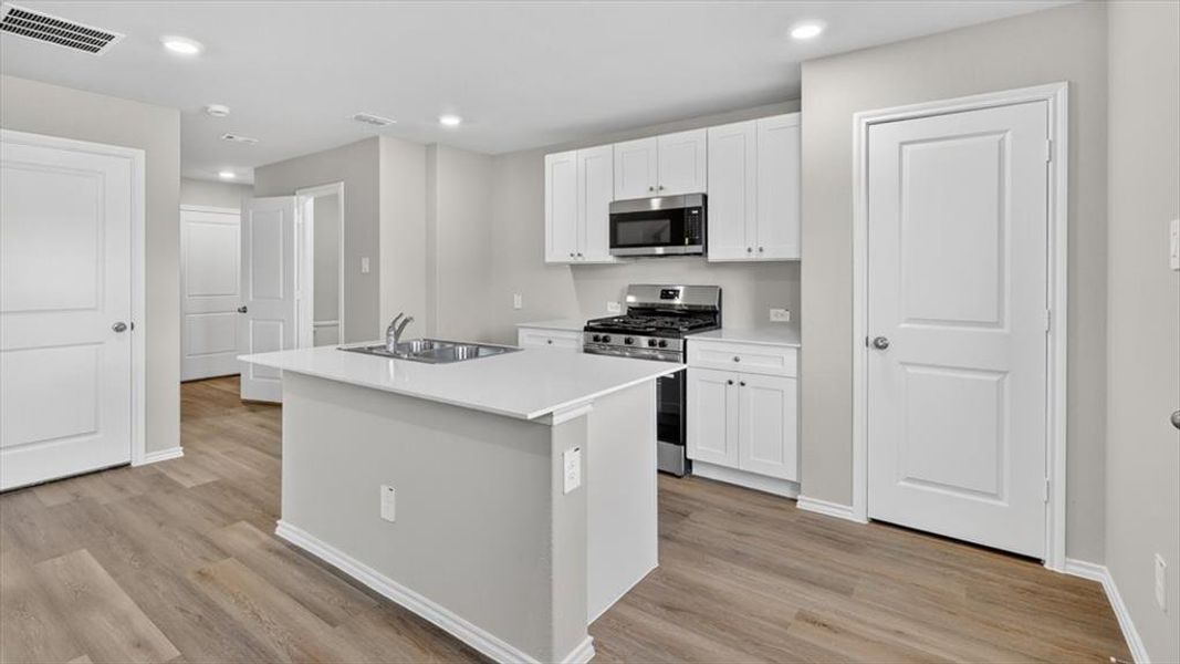 Kitchen-All Home and community information, including pricing, included features, terms, availability and amenities, are subject to change at any time without notice or obligation. All Drawings, pictures, photographs, video, square footages, floor plans, elevations, features, colors and sizes are approximate for illustration purposes only and will vary from the homes as built.