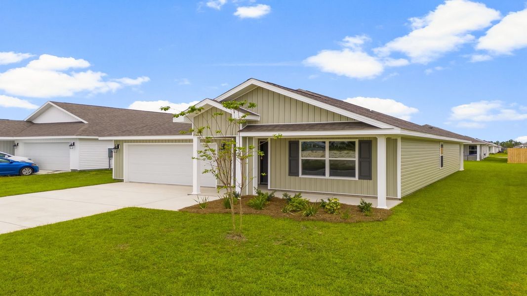 Front exterior of a new home in Park Place, Panama City, FL, highlighting curb appeal (Image 17). Front exterior of a new home in Park Place, Panama City, FL, highlighting curb appeal (Image 17).