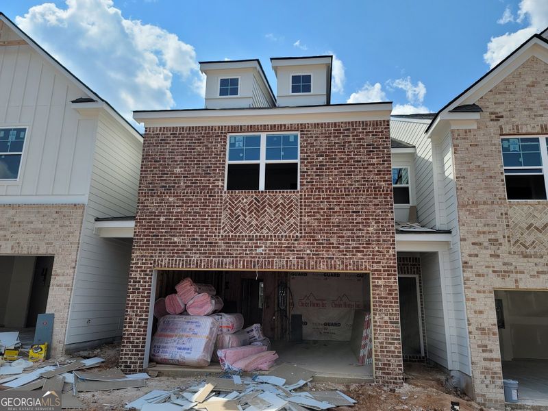 In-progress construction of a new home in The Towns at Auburn Station West, Auburn, GA (Image 21).
