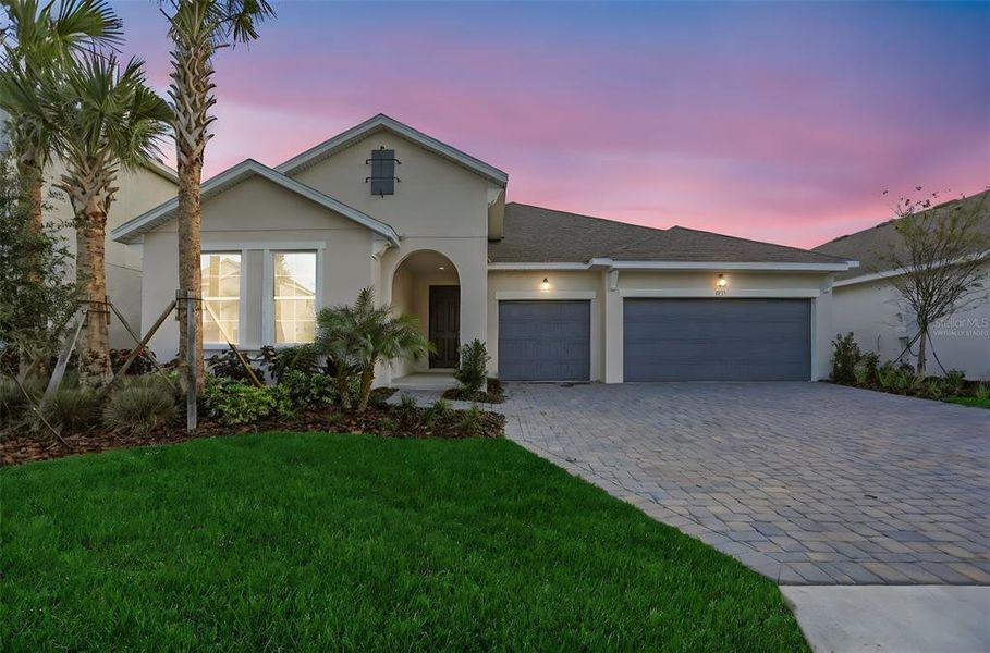 Front exterior of a new home in Seaire, Parrish, FL, highlighting curb appeal (Image 23).