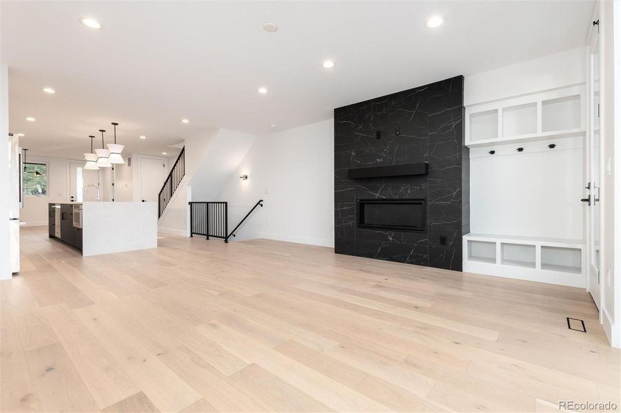 Fireplace, Built-Ins and Waterfall Countertop Kitchen Island