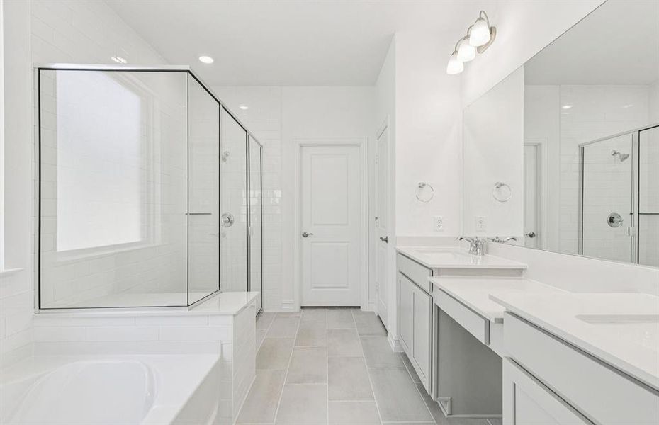 Owner's bath complete with double sinks and a generous shower Owner's bath complete with double sinks and a generous shower