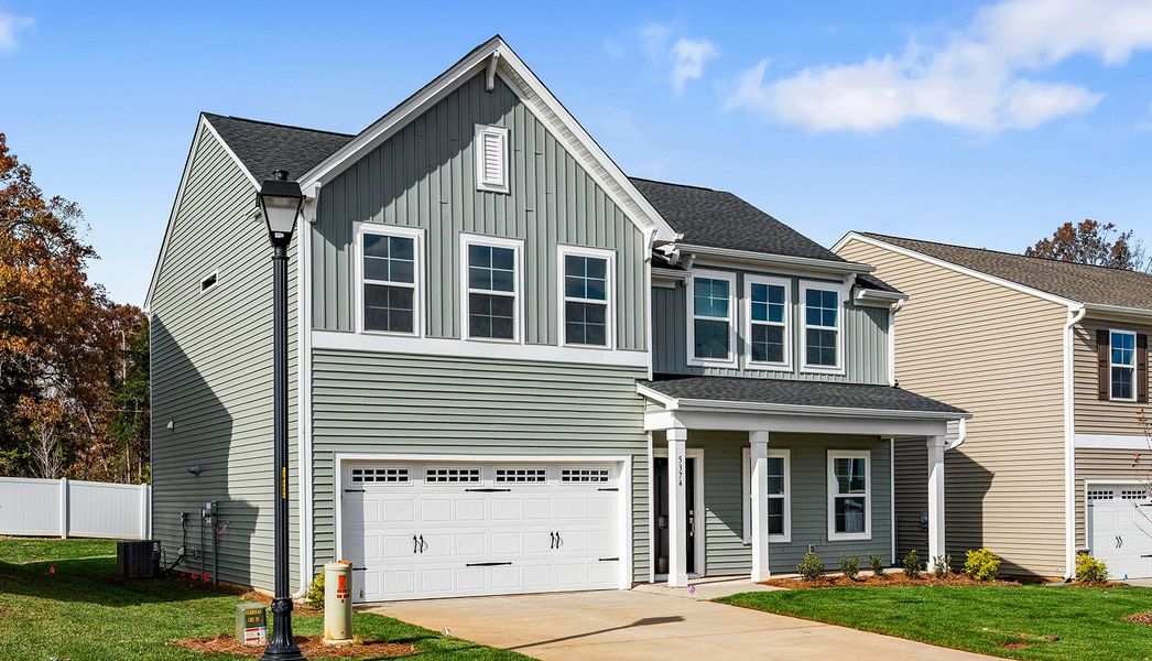 Front exterior of a new home in Hanes Lake, Winston-Salem, NC, highlighting curb appeal (Image 2). Front exterior of a new home in Hanes Lake, Winston-Salem, NC, highlighting curb appeal (Image 2).