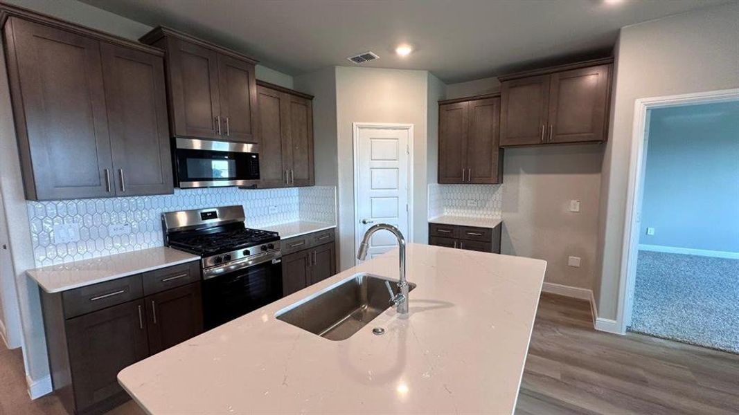 Kitchen - All Home and community information, including pricing, included features, terms, availability and amenities, are subject to change at any time without notice or obligation. All Drawings, pictures, photographs, video, square footages, floor plans, elevations, features, colors and sizes are approximate for illustration purposes only and will vary from the homes as built. Kitchen - All Home and community information, including pricing, included features, terms, availability and amenities, are subject to change at any time without notice or obligation. All Drawings, pictures, photographs, video, square footages, floor plans, elevations, features, colors and sizes are approximate for illustration purposes only and will vary from the homes as built.
