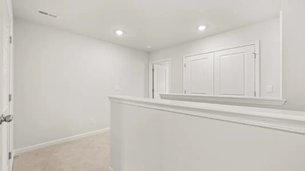 Representative unfurnished interior of a home built from the Pattison by D.R. Horton in Branford Crossing, Stockbridge (Image 12).