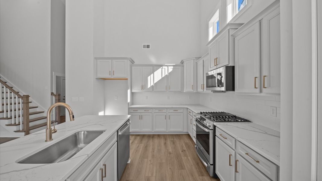 Stylish and efficient kitchen with a modest island and sleek, current design